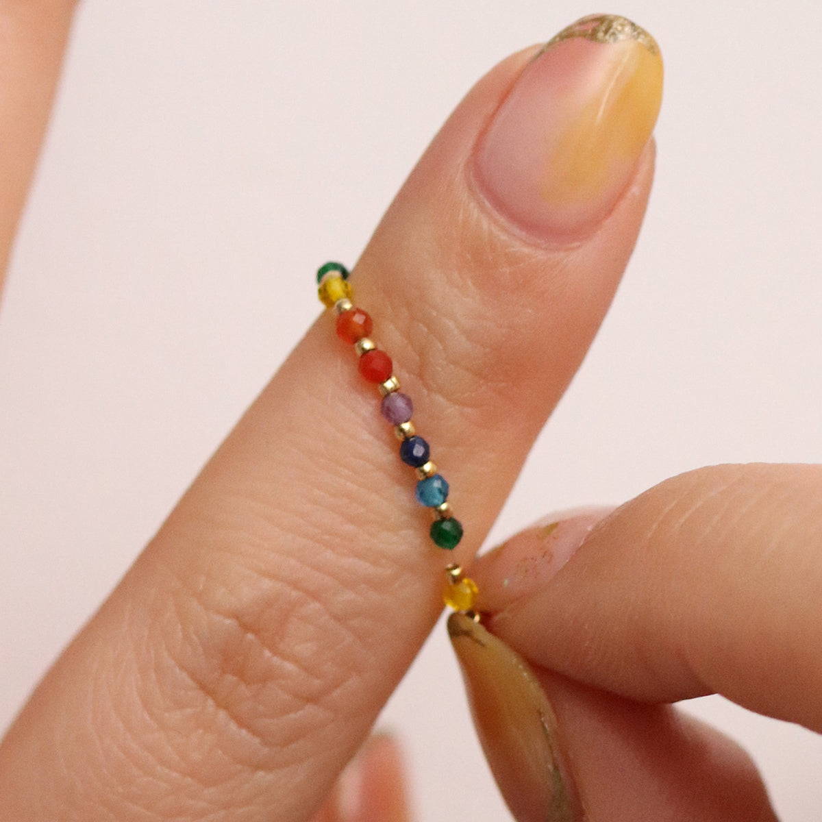 Stretchy Gemstone Ring featuring semi-precious gemstones and delicate sterling silver plated beads, offering a comfortable fit with a touch of refined elegance.