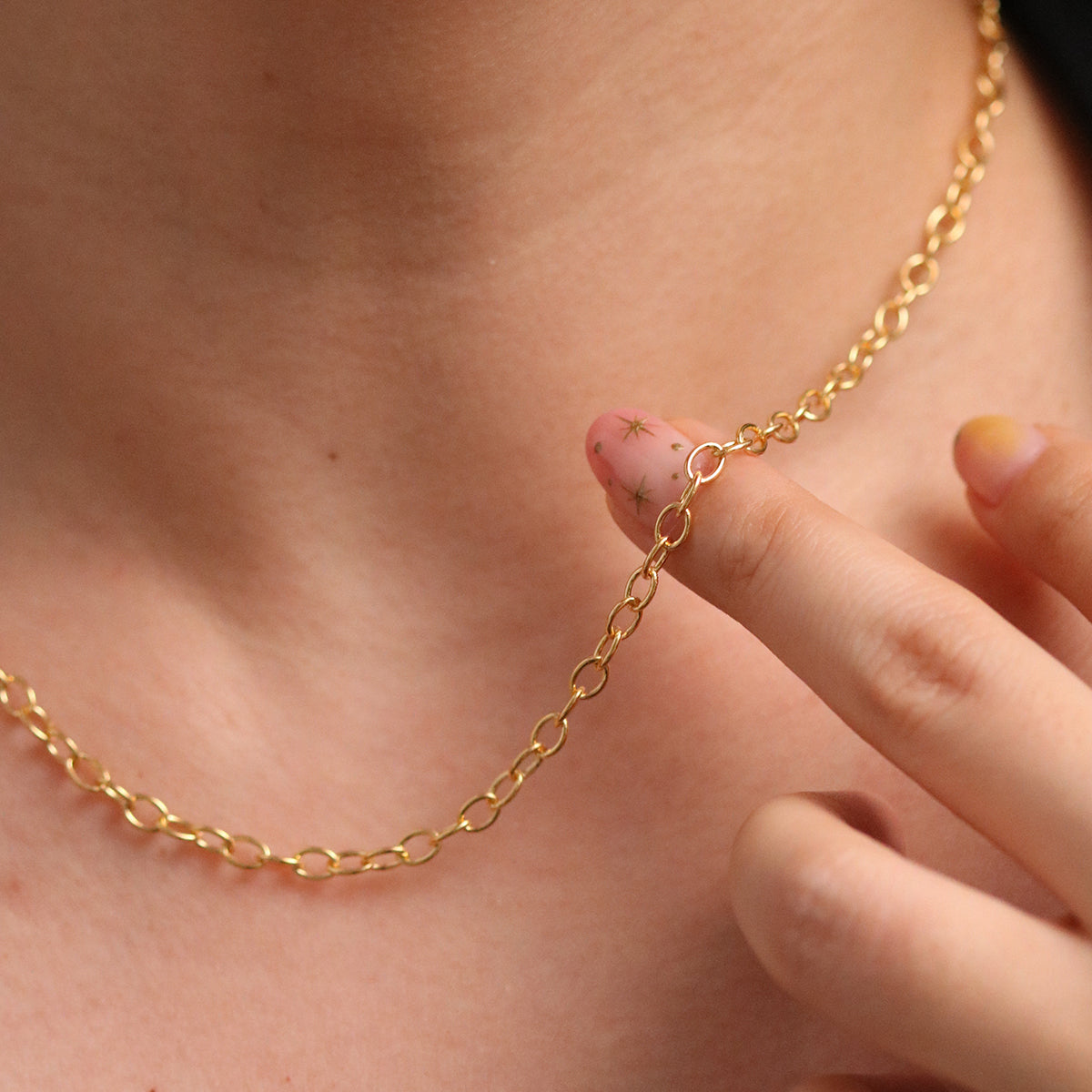 Stylish medium oval chain necklace with smooth, elongated oval links, offering a balanced and elegant design with a polished finish.