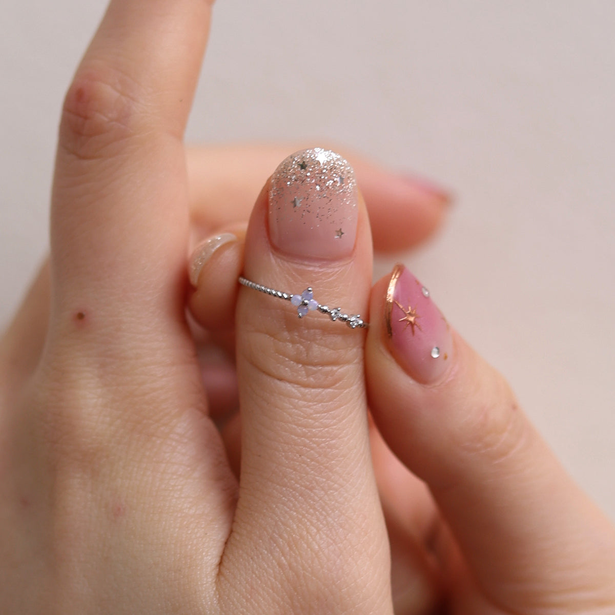Moonstone Cubic Flower Ring handcrafted with a glowing moonstone centre and delicate cubic flower petals, blending natural beauty.