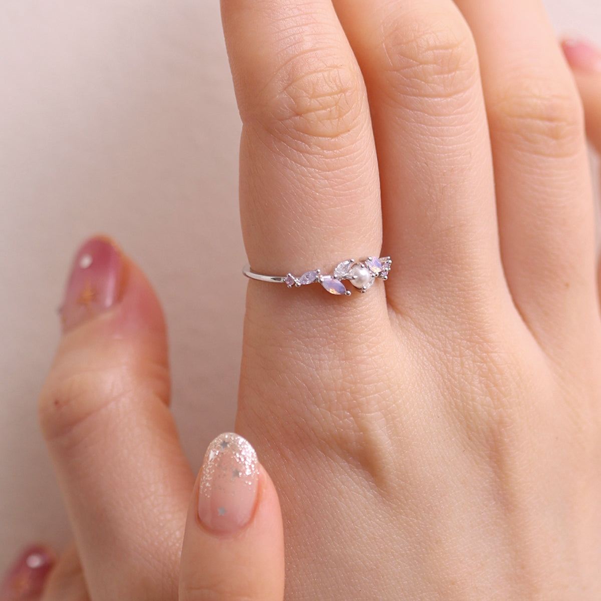 Moonstone Cubic Pearl Vine Ring featuring a delicate vine design with shimmering moonstone and lustrous cubic pearls, crafted for timeless elegance and sophistication.