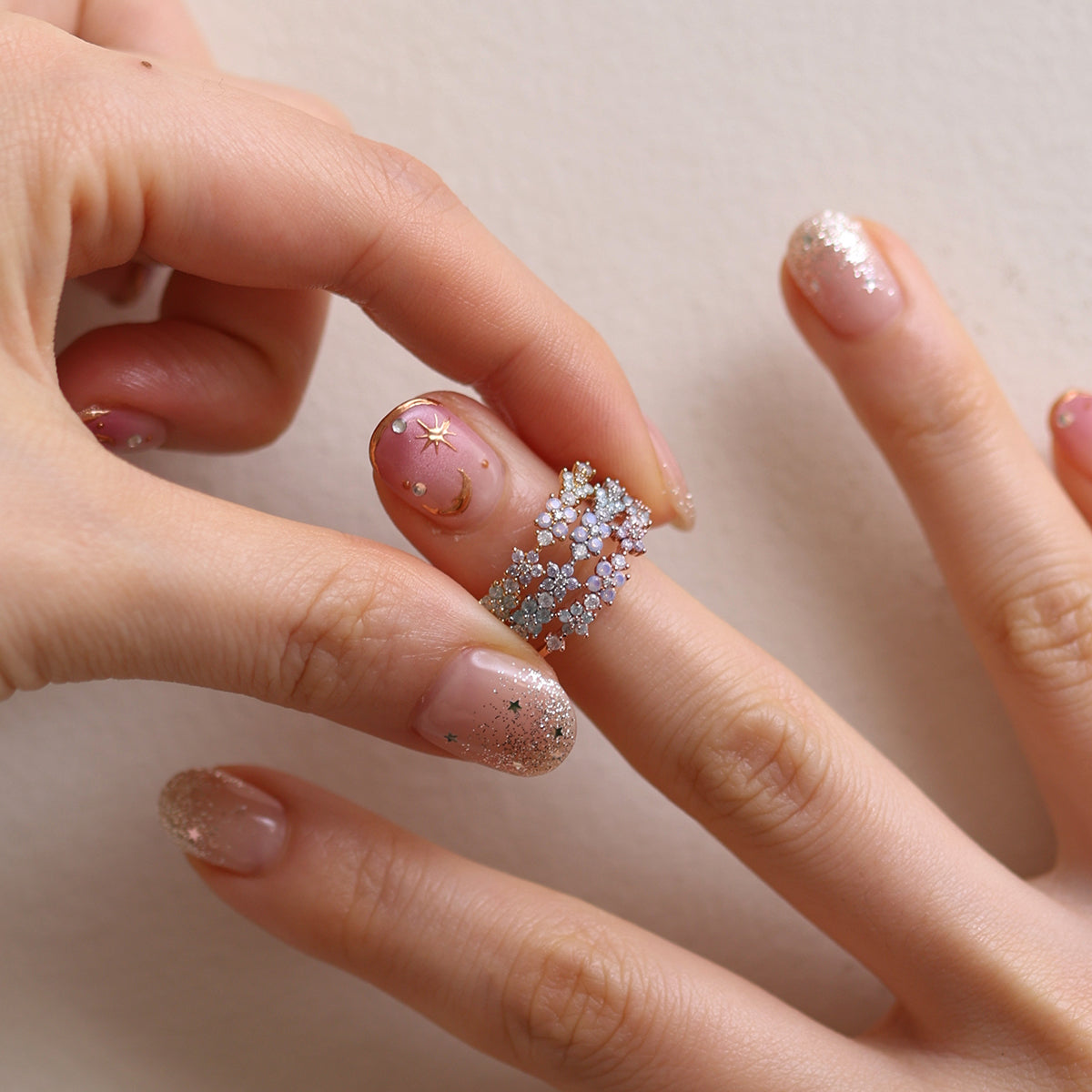 Moonstone Flower Ring featuring a radiant moonstone centre and delicate floral design, crafted from high-quality materials for a touch of timeless elegance.