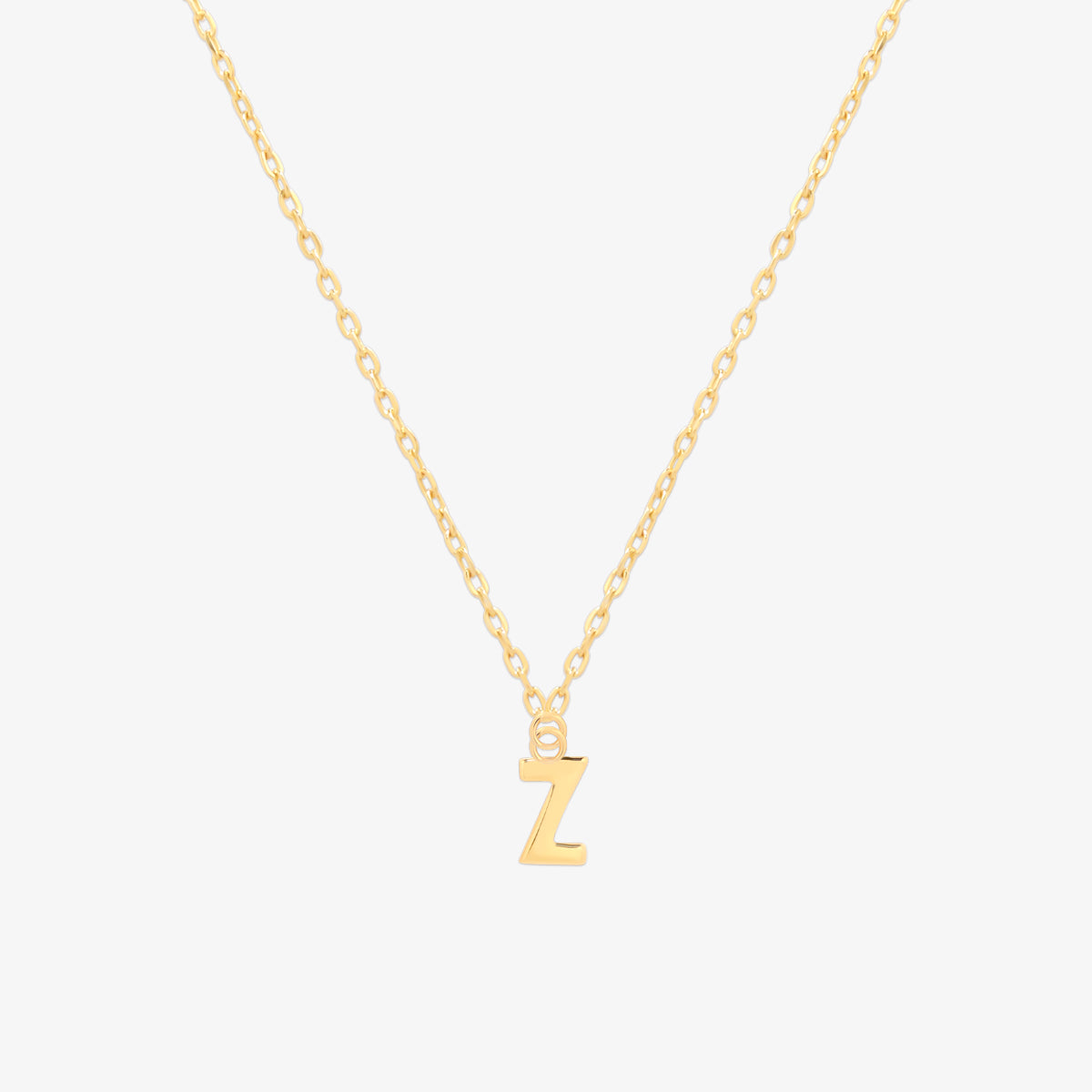 Classic initial pendant necklace featuring a polished letter charm on a delicate chain, showcasing a timeless and elegant design.