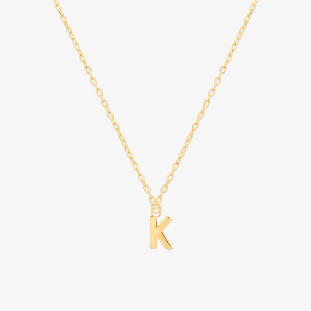 Classic initial pendant necklace featuring a polished letter charm on a delicate chain, showcasing a timeless and elegant design.
