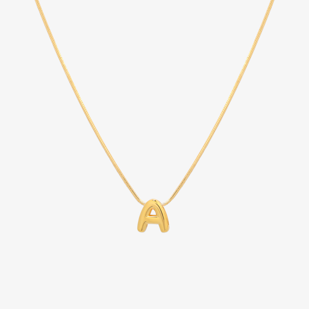Bubble initial pendant necklace featuring a rounded, playful letter charm on a sleek snake chain, with a smooth and glossy finish.