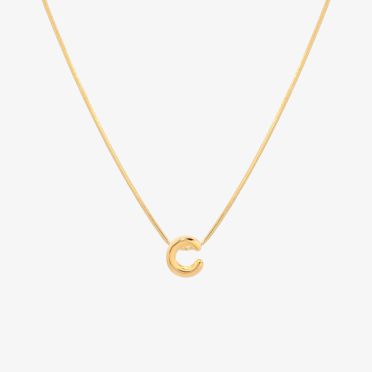 Bubble initial pendant necklace featuring a rounded, playful letter charm on a sleek snake chain, with a smooth and glossy finish.
