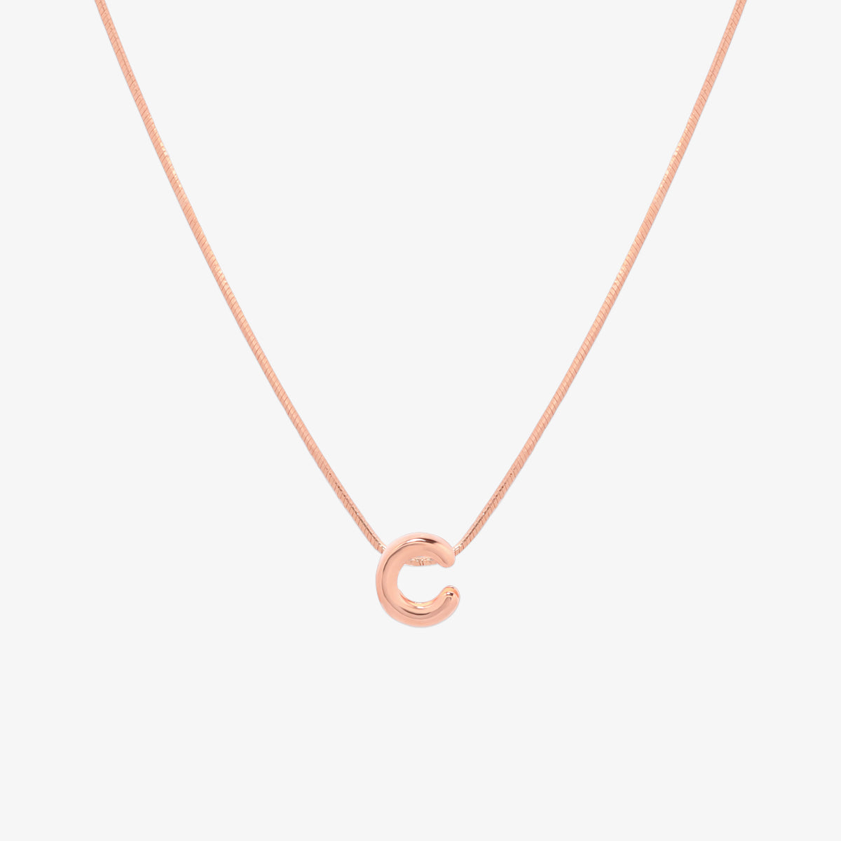 Bubble initial pendant necklace featuring a rounded, playful letter charm on a sleek snake chain, with a smooth and glossy finish.