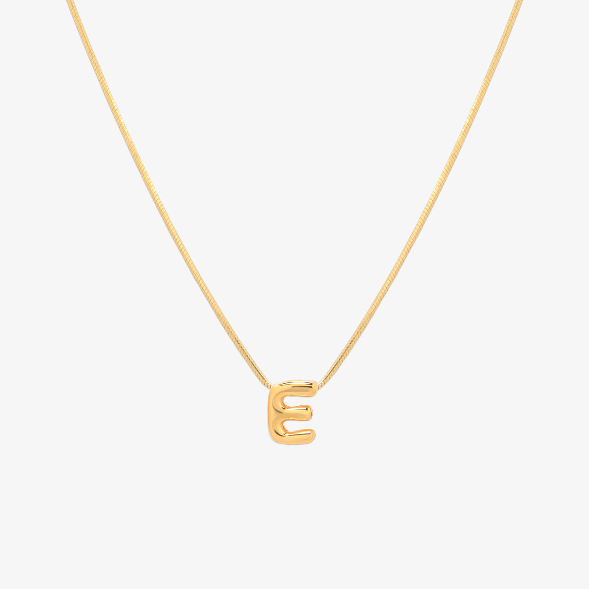 Bubble initial pendant necklace featuring a rounded, playful letter charm on a sleek snake chain, with a smooth and glossy finish.