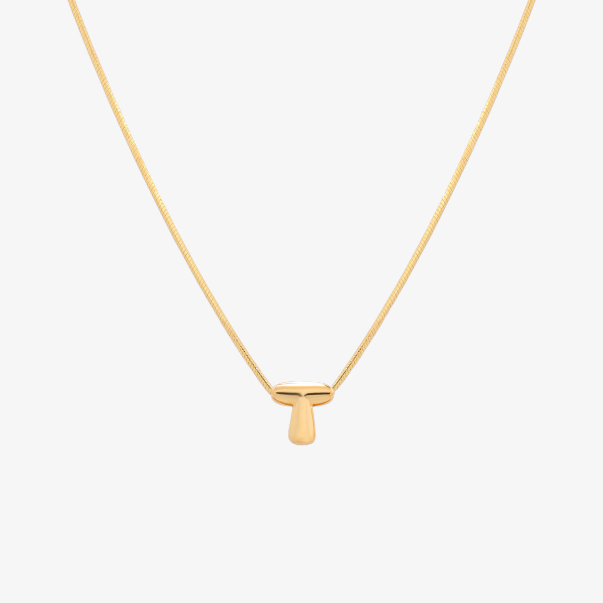 Bubble initial pendant necklace featuring a rounded, playful letter charm on a sleek snake chain, with a smooth and glossy finish.