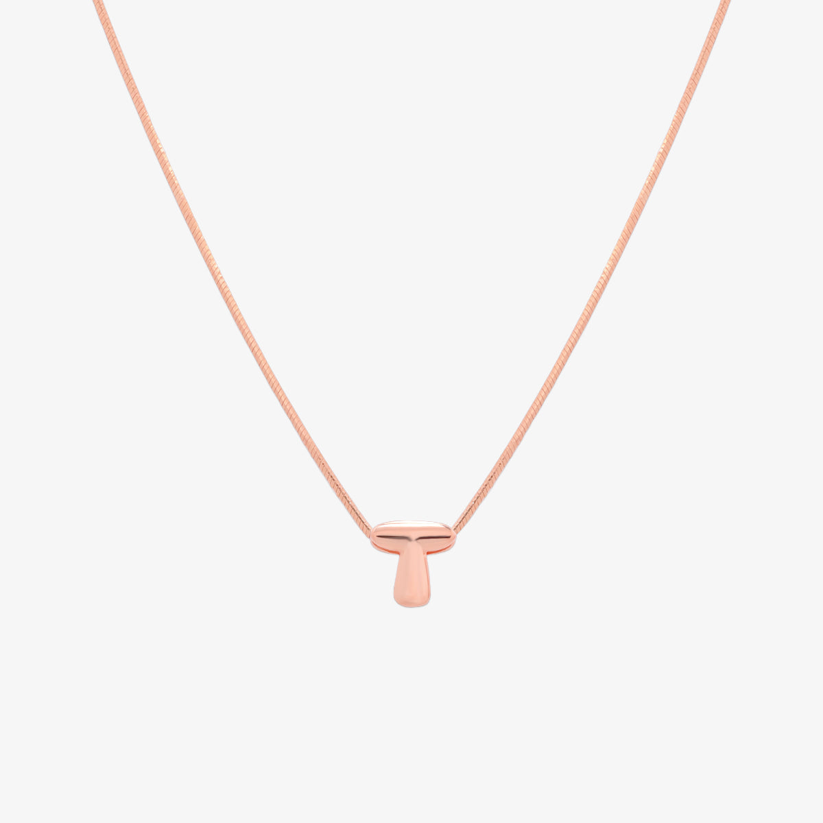 Bubble initial pendant necklace featuring a rounded, playful letter charm on a sleek snake chain, with a smooth and glossy finish.