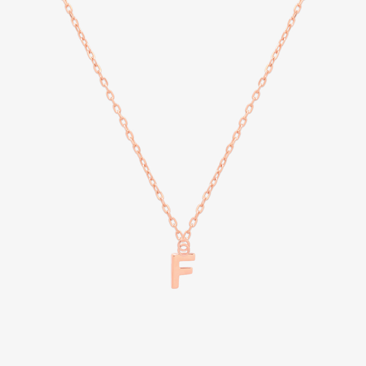 Classic initial pendant necklace featuring a polished letter charm on a delicate chain, showcasing a timeless and elegant design.