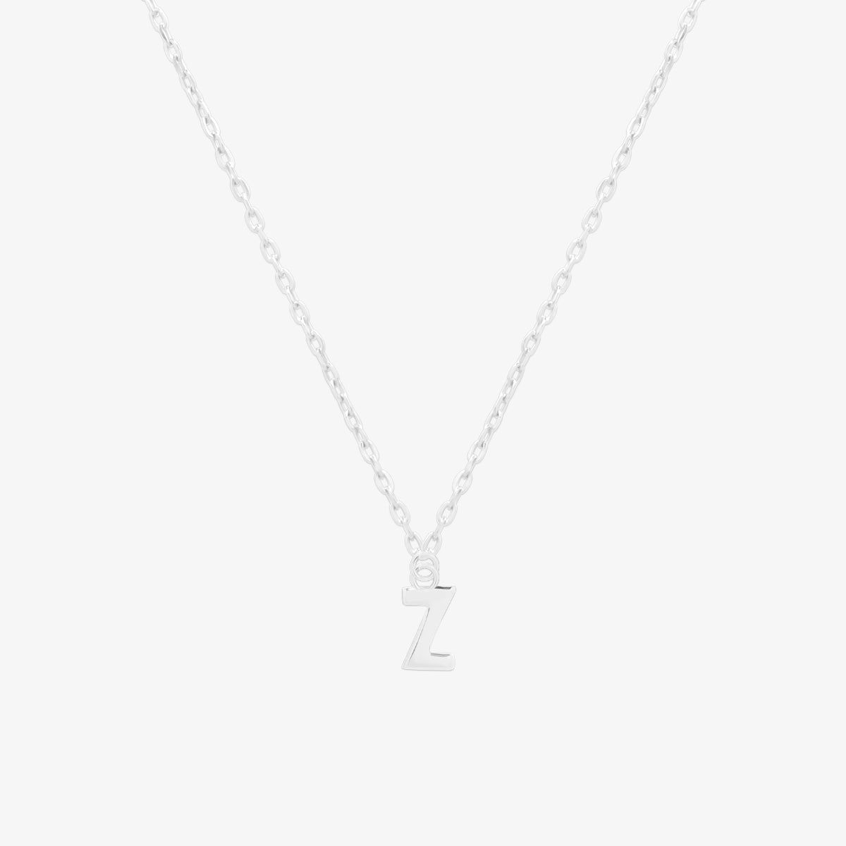 Classic initial pendant necklace featuring a polished letter charm on a delicate chain, showcasing a timeless and elegant design.