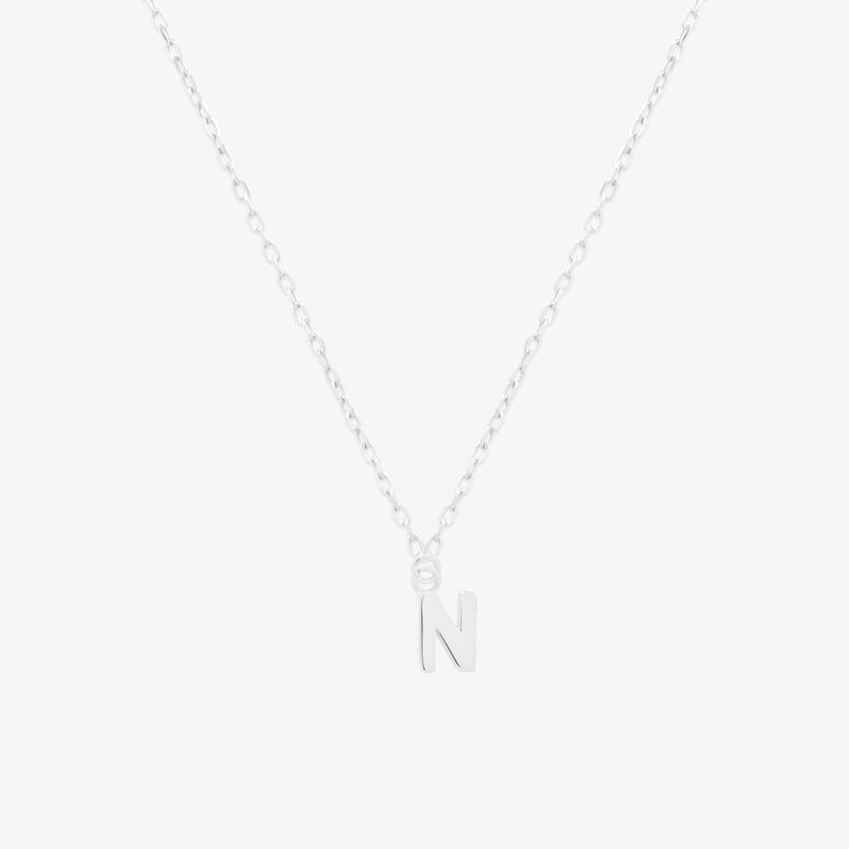Classic initial pendant necklace featuring a polished letter charm on a delicate chain, showcasing a timeless and elegant design.