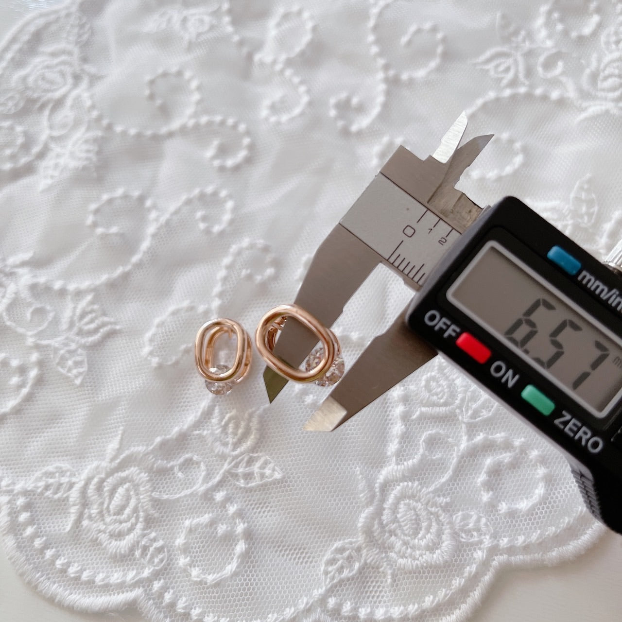 Cubic oval huggie earrings