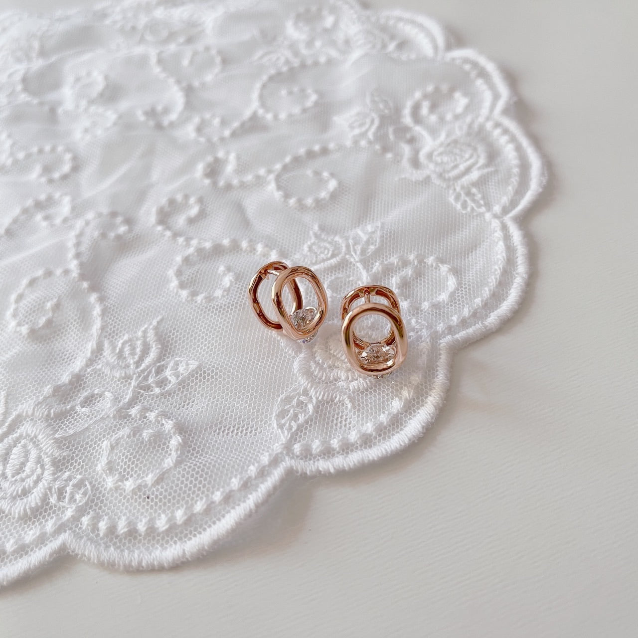 Cubic oval huggie earrings