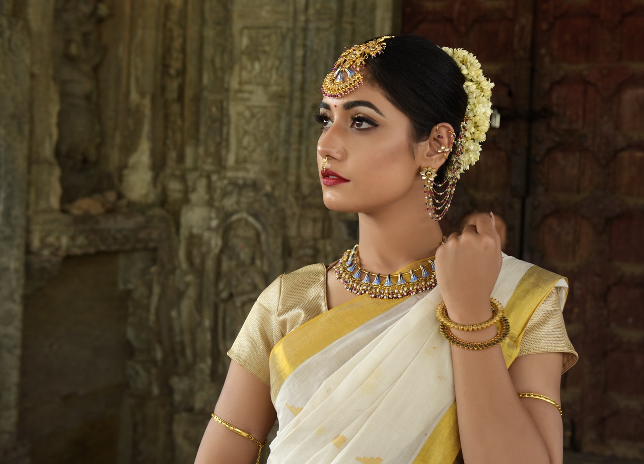 woman wearing gold jewellery