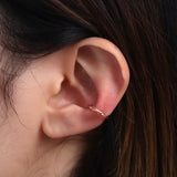 Twisted line ear cuff