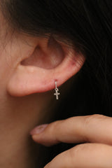 Cross charm huggie earring