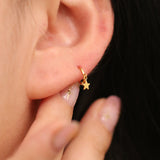 Star charm huggie earring