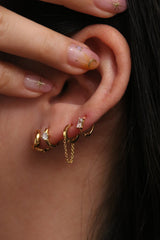 Single cubic huggie earring
