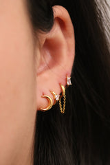 Single cubic huggie earring