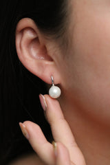 Pearl drop huggie earrings