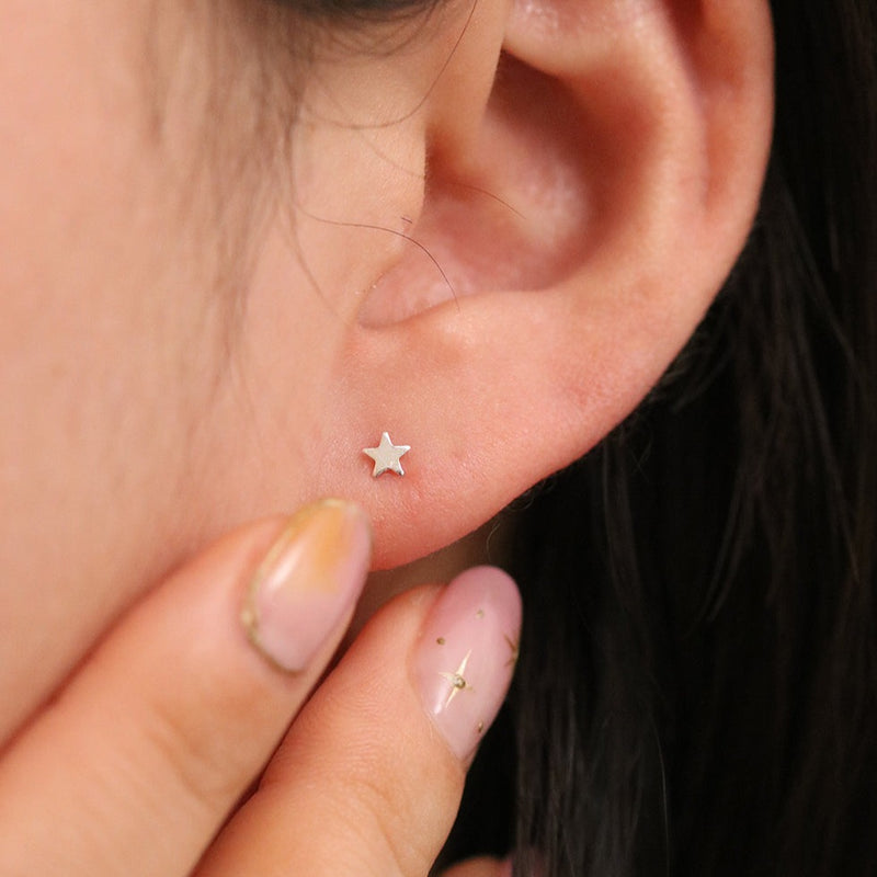 Tiny star stud earrings