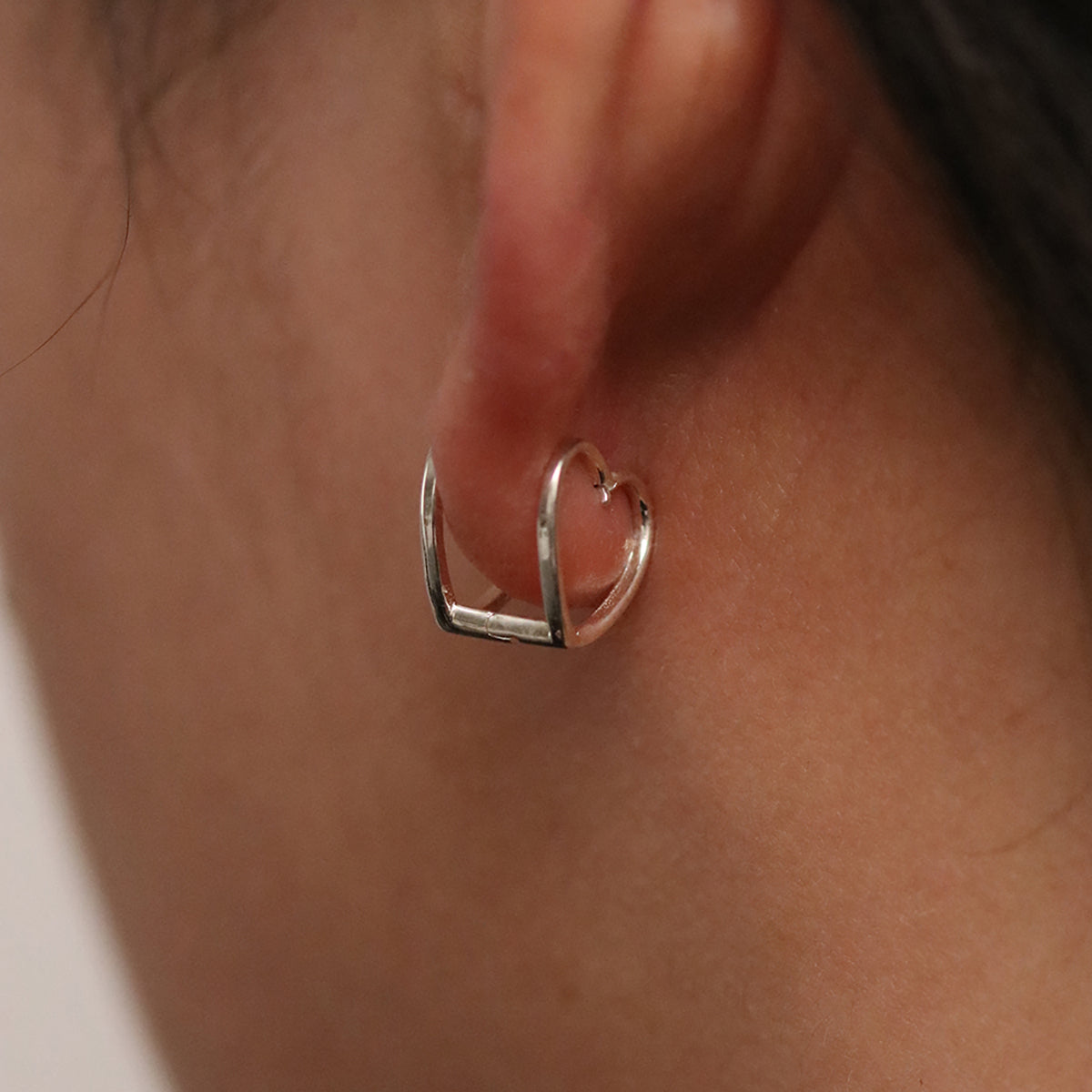 Heart silhouette huggie earrings