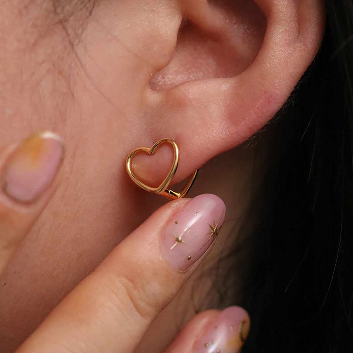 Heart silhouette huggie earrings