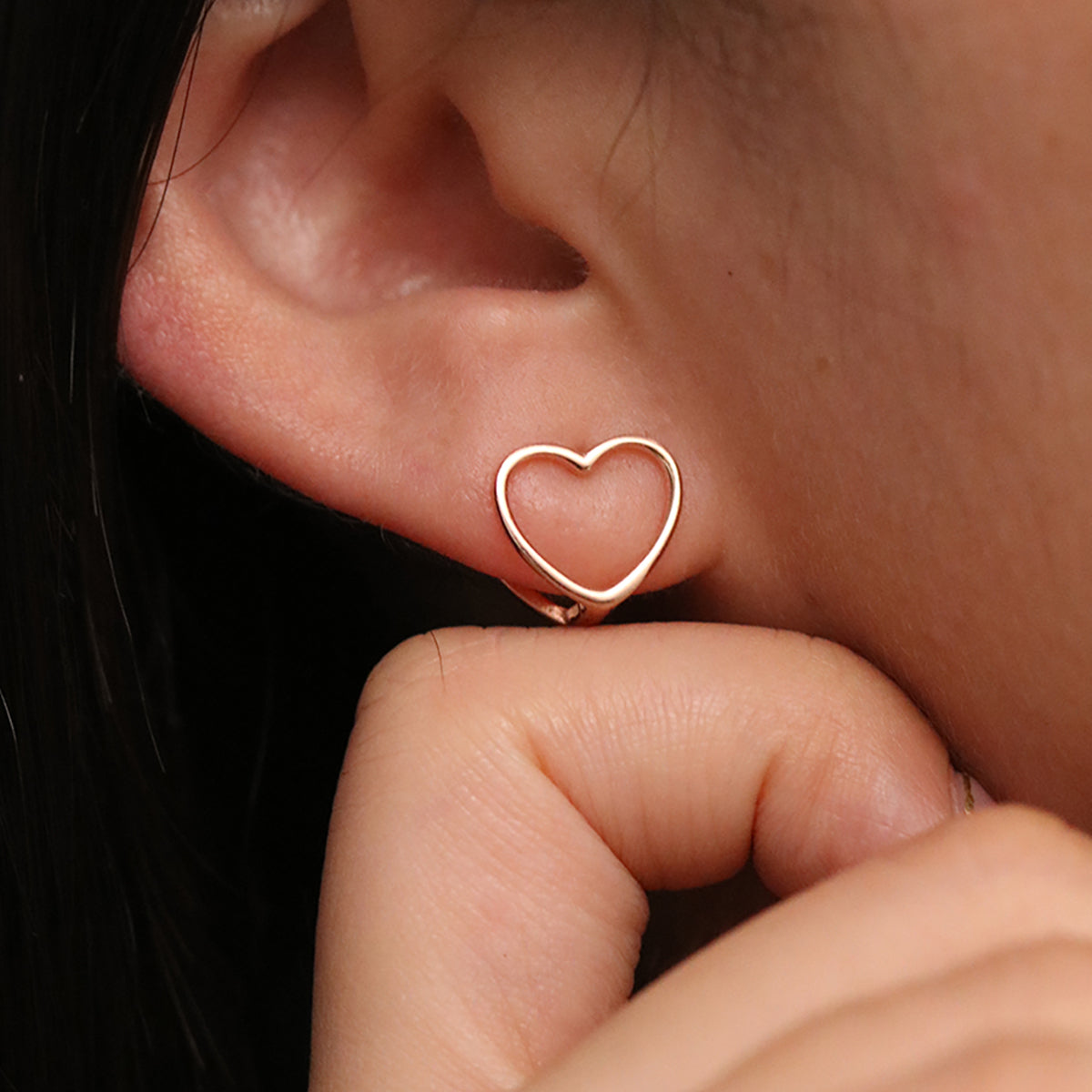 Heart silhouette huggie earrings