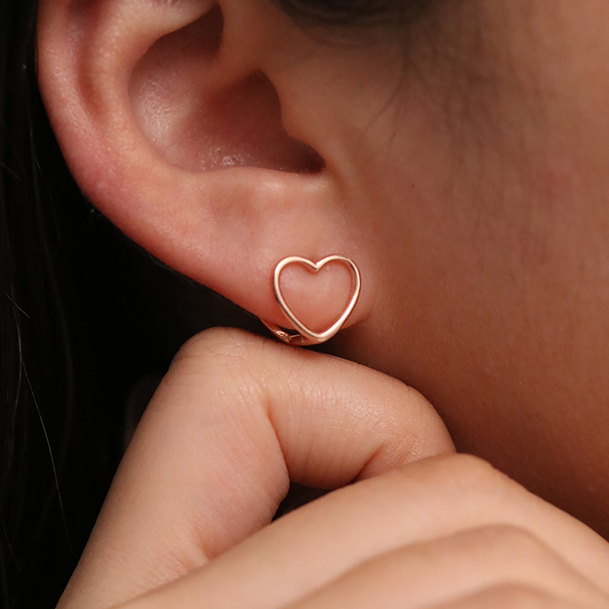 Heart silhouette huggie earrings