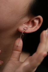 Angled knot drop clip on earrings