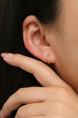Cubic twirl huggie earrings