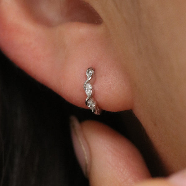 Cubic twirl huggie earrings