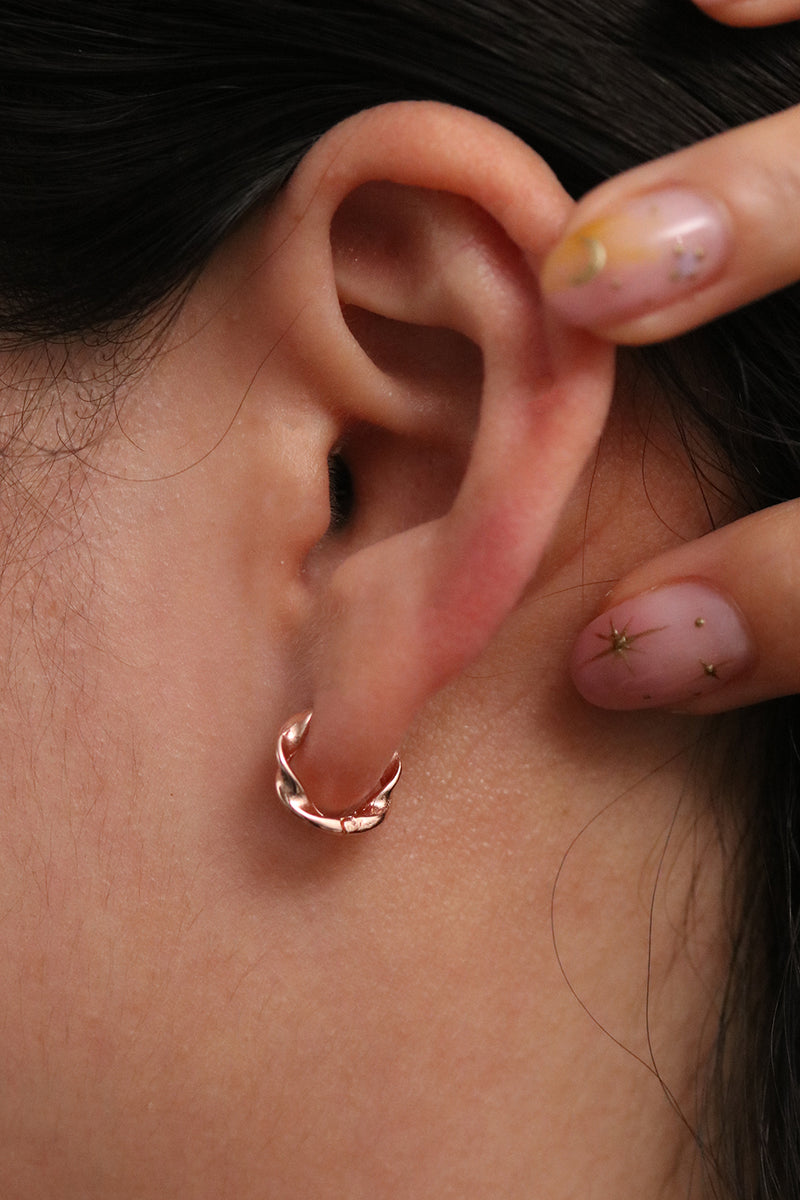 Twisted huggie earrings